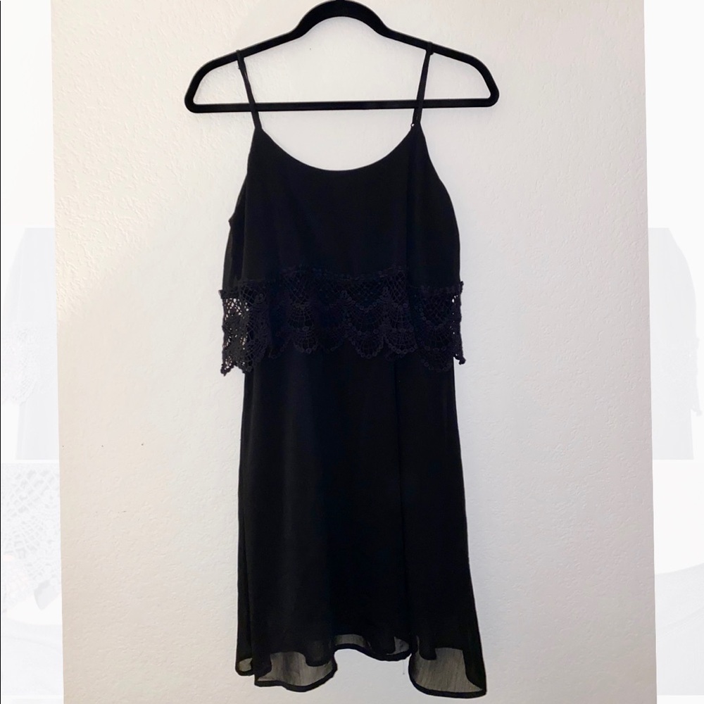 Layered black dress with lace details